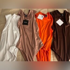 Lot Of 4 Sleeveless Bodysuits